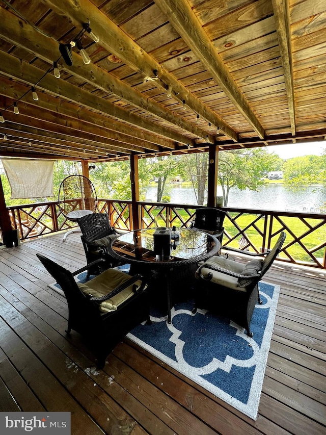 wooden terrace with a water view