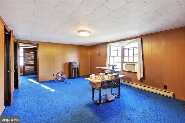 interior space featuring cooling unit, a baseboard heating unit, and wooden walls