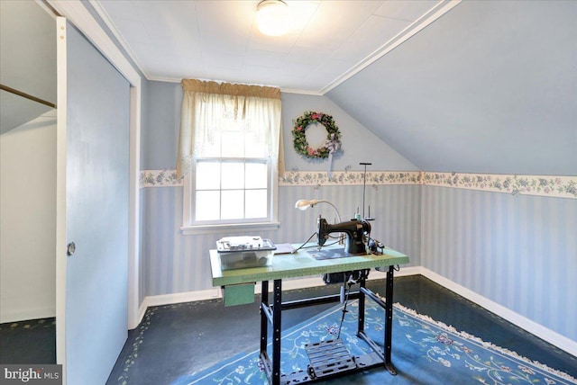 home office with lofted ceiling and ornamental molding