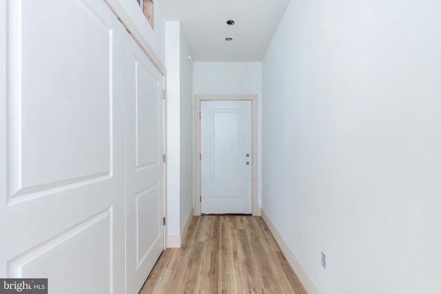 hall with light wood-type flooring