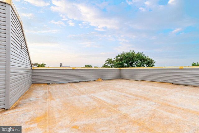 view of patio terrace at dusk