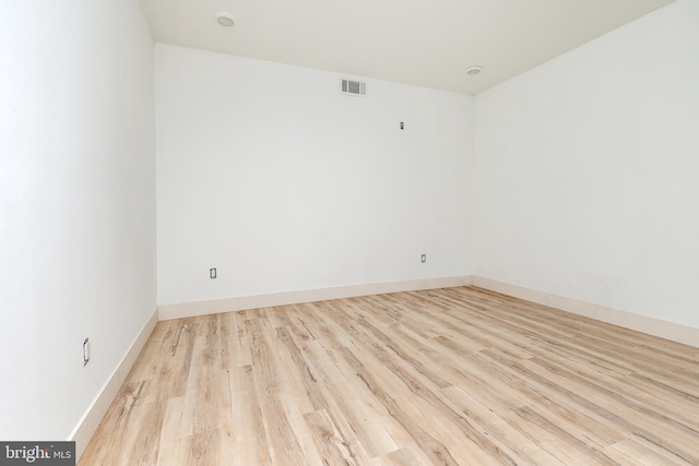 spare room with light hardwood / wood-style floors