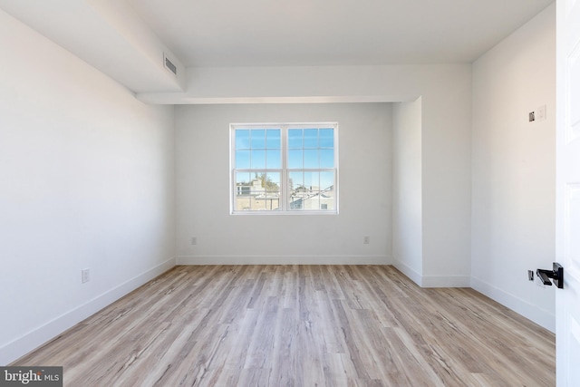 unfurnished room featuring light hardwood / wood-style floors