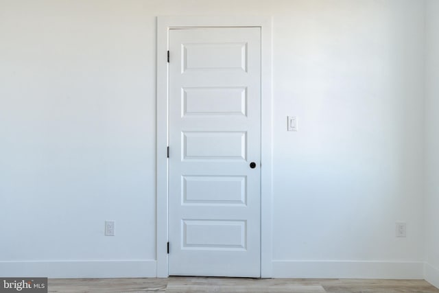 empty room with light hardwood / wood-style floors