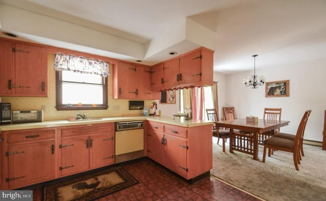 kitchen with hanging light fixtures, kitchen peninsula, white dishwasher, sink, and an inviting chandelier