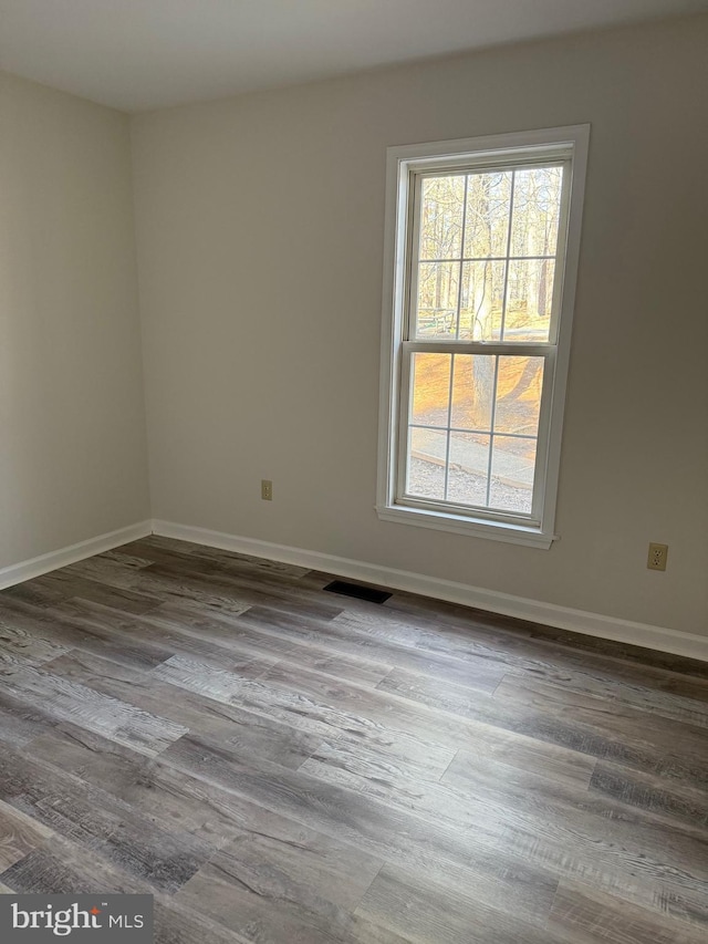 empty room featuring hardwood / wood-style flooring