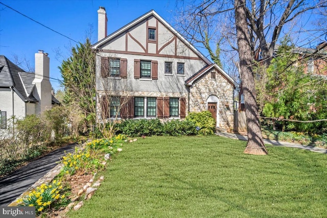 4619 Langdrum Ln, Chevy Chase, MD 20815 - tudor home with a chimney, a front lawn, and stone siding