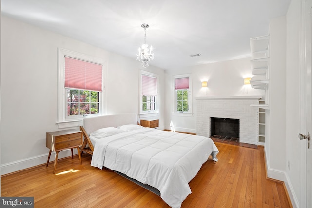 4619 Langdrum Ln, Chevy Chase, MD 20815 - bedroom with baseboards, light wood finished floors, a chandelier, and visible vents