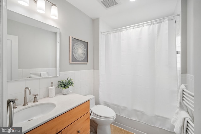 4619 Langdrum Ln, Chevy Chase, MD 20815 - bathroom with visible vents, vanity, shower / bath combination with curtain, toilet, and tile walls