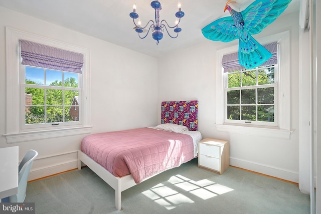4619 Langdrum Ln, Chevy Chase, MD 20815 - bedroom featuring carpet flooring, baseboards, and an inviting chandelier