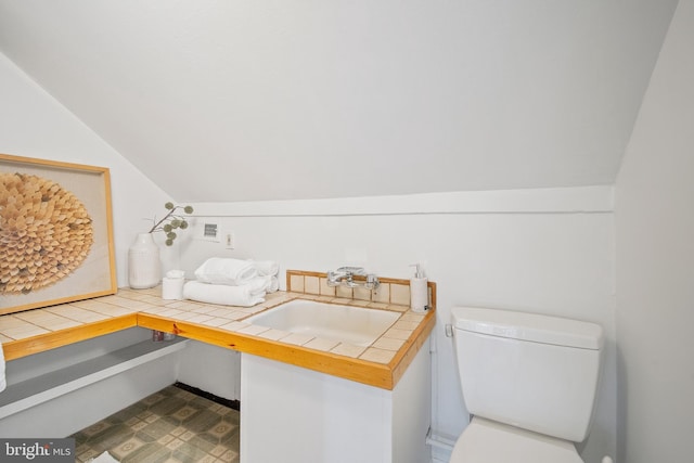 4619 Langdrum Ln, Chevy Chase, MD 20815 - bathroom featuring toilet, vaulted ceiling, and vanity