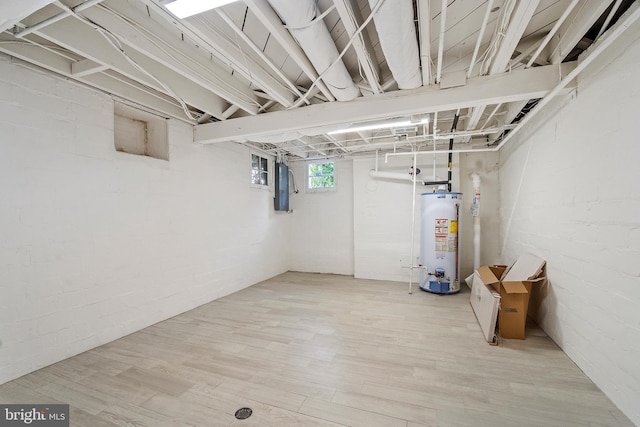 4619 Langdrum Ln, Chevy Chase, MD 20815 - below grade area with water heater, electric panel, and wood finished floors