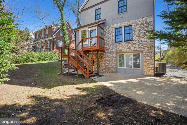 4619 Langdrum Ln, Chevy Chase, MD 20815 - back of house with central AC, stone siding, stairway, a deck, and a patio area