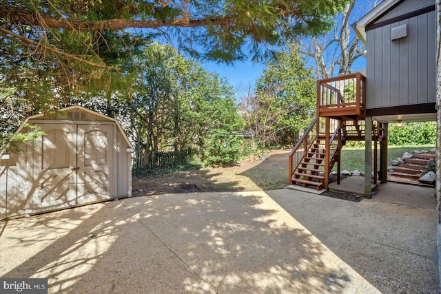 4619 Langdrum Ln, Chevy Chase, MD 20815 - view of patio / terrace with stairway, a wooden deck, an outdoor structure, and a storage unit