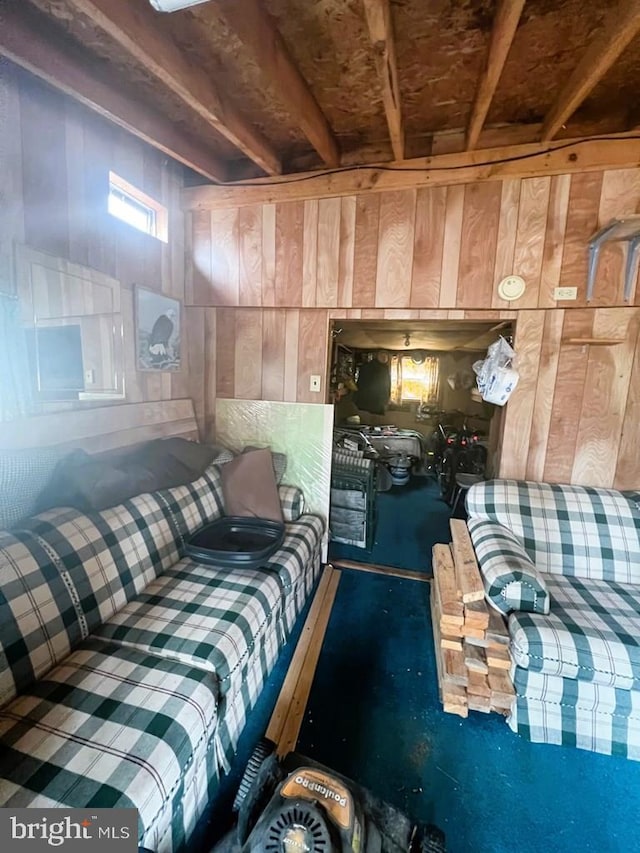 living room featuring wood walls