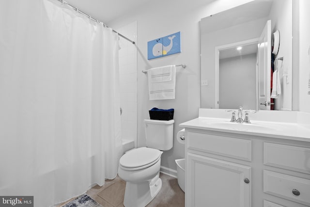 full bathroom featuring vanity, tile patterned flooring, toilet, and shower / bathtub combination with curtain