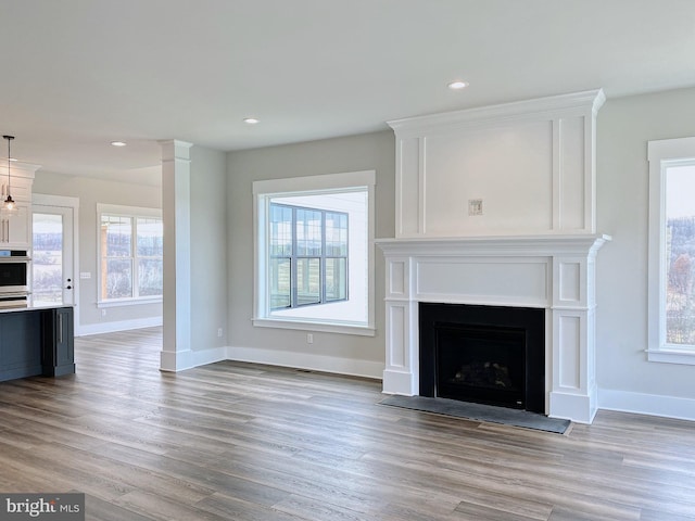 76 Long Ln, Kirkwood, PA 17536 - unfurnished living room featuring recessed lighting, wood finished floors, baseboards, and a fireplace with flush hearth