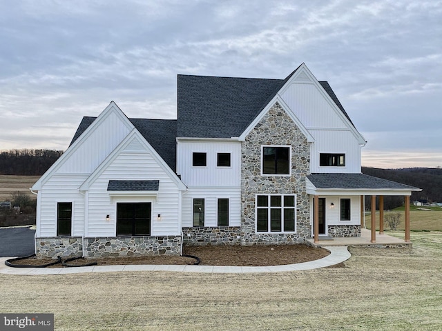 76 Long Ln, Kirkwood, PA 17536 - modern inspired farmhouse with board and batten siding, stone siding, and covered porch