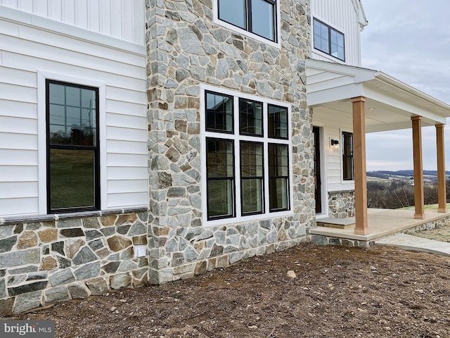 76 Long Ln, Kirkwood, PA 17536 - view of property exterior featuring a porch, stone siding, and board and batten siding