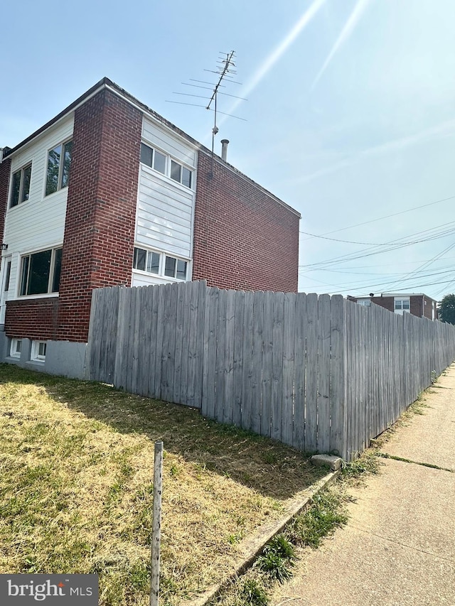 view of property exterior featuring a yard