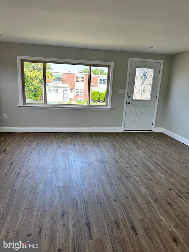 entrance foyer with dark hardwood / wood-style floors