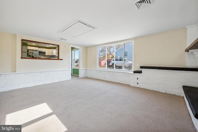 unfurnished living room featuring carpet floors