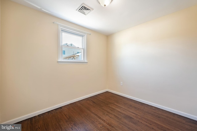 unfurnished room featuring hardwood / wood-style floors