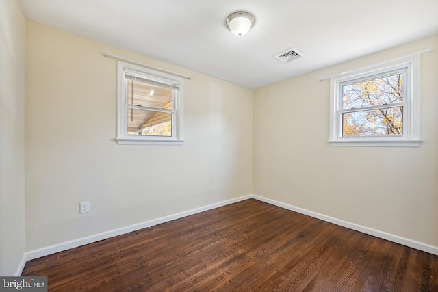 empty room featuring wood-type flooring