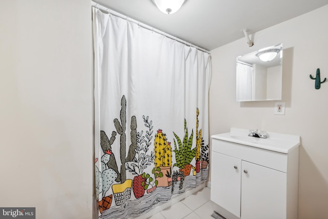 bathroom with tile patterned flooring and vanity