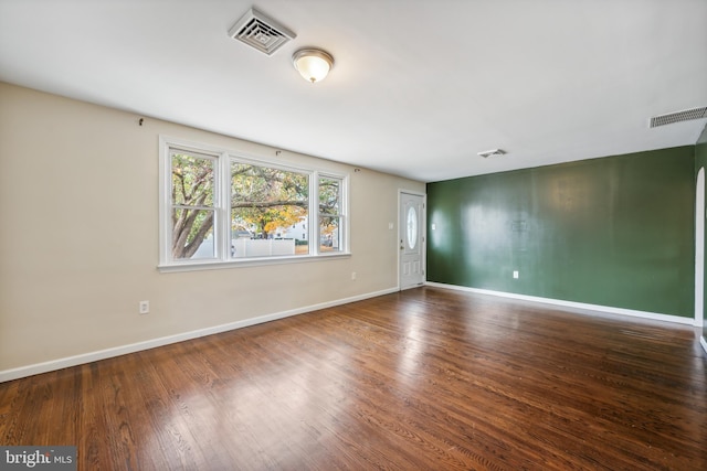 empty room featuring hardwood / wood-style flooring