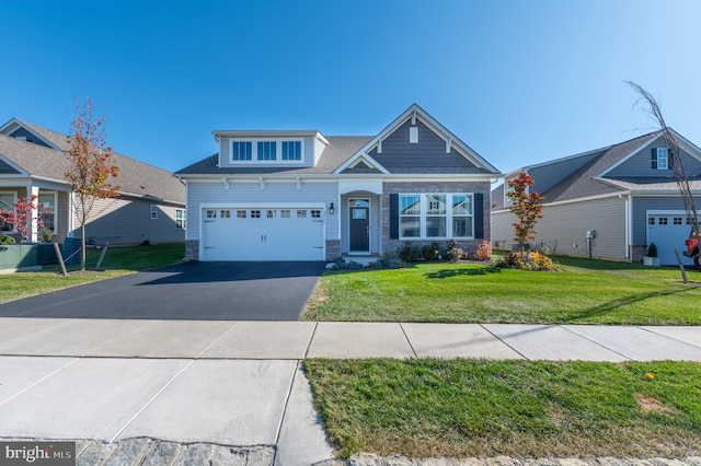 craftsman-style house with a garage and a front lawn