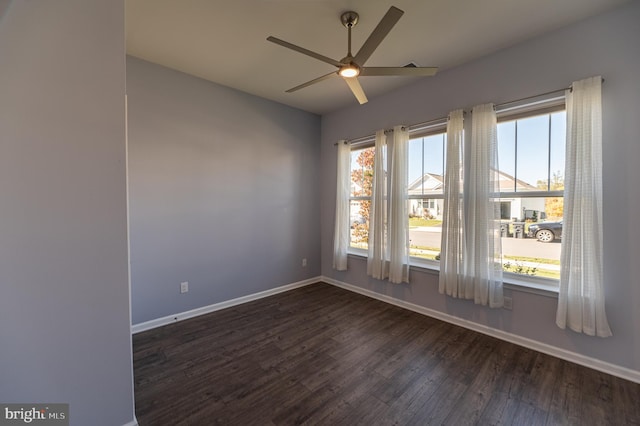 unfurnished room with ceiling fan and dark hardwood / wood-style floors