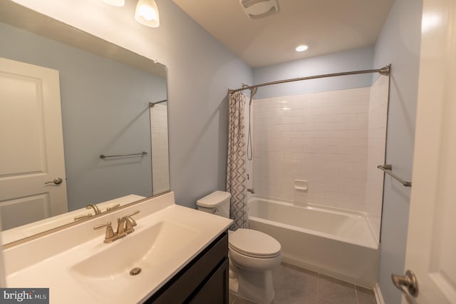 full bathroom featuring toilet, shower / bath combo, vanity, and tile patterned floors