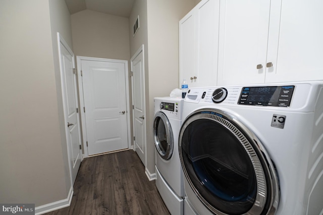 clothes washing area with cabinets, dark hardwood / wood-style floors, and independent washer and dryer