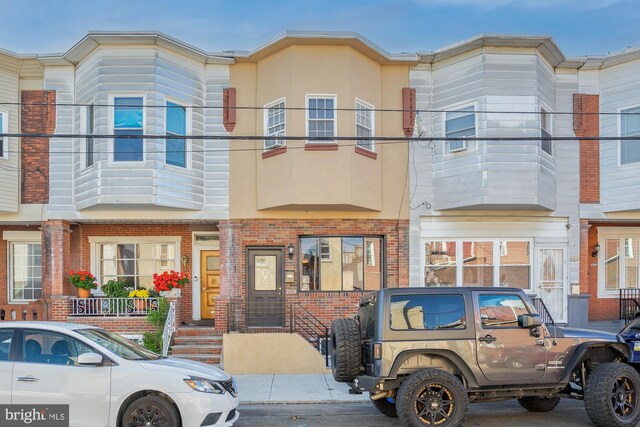 view of property featuring a balcony