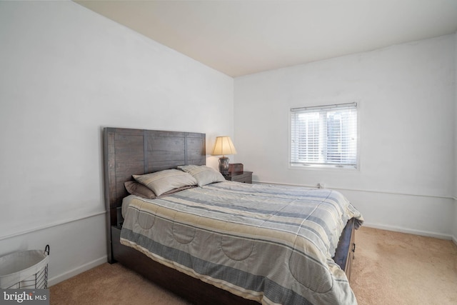 bedroom featuring carpet flooring and baseboards