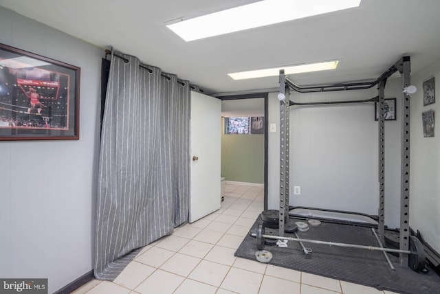 workout room featuring light tile patterned flooring