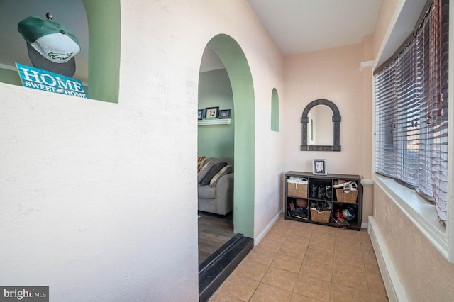 hallway with light tile patterned flooring