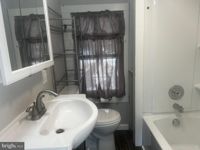 full bathroom featuring shower / bath combination, sink, and toilet