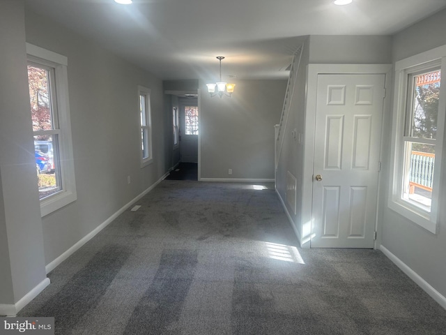 interior space featuring dark carpet