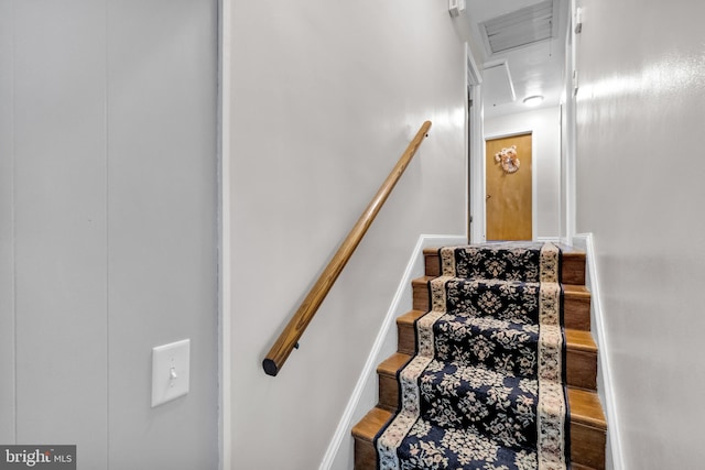 stairway featuring wood-type flooring