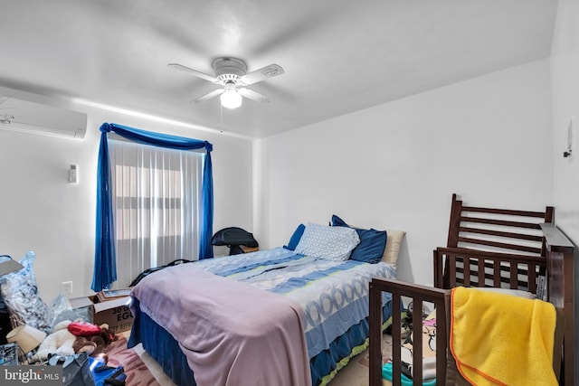 bedroom with ceiling fan and a wall unit AC