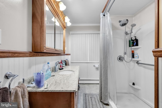 bathroom featuring vanity, a shower with curtain, and baseboard heating