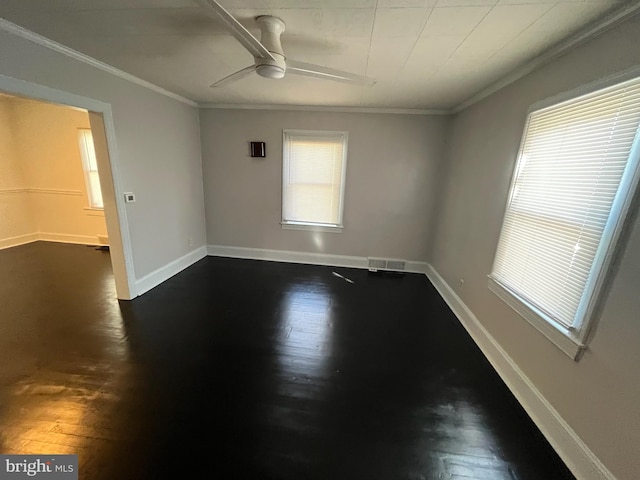 unfurnished room featuring ceiling fan, ornamental molding, and dark hardwood / wood-style floors