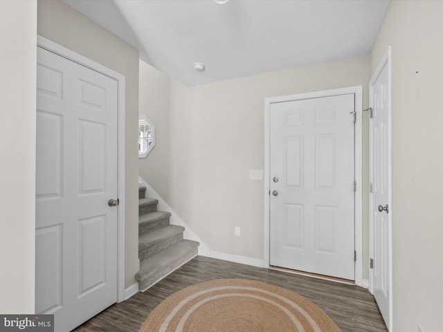 foyer entrance with dark hardwood / wood-style floors