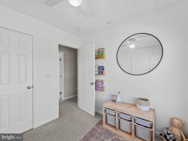 interior space with ceiling fan