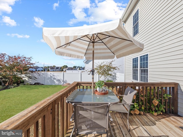 wooden deck with a yard