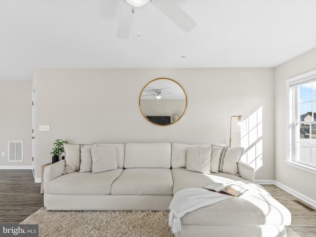 living room with hardwood / wood-style floors and ceiling fan