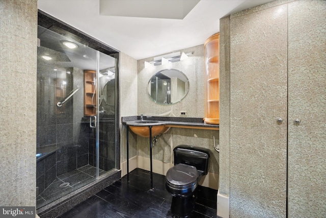 bathroom with a shower with door, tile patterned floors, and toilet