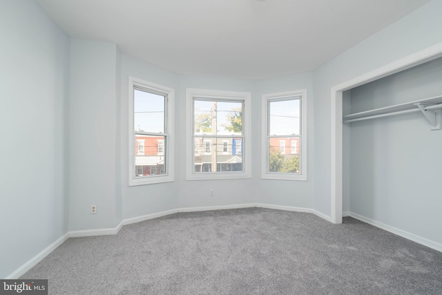 unfurnished bedroom with carpet floors